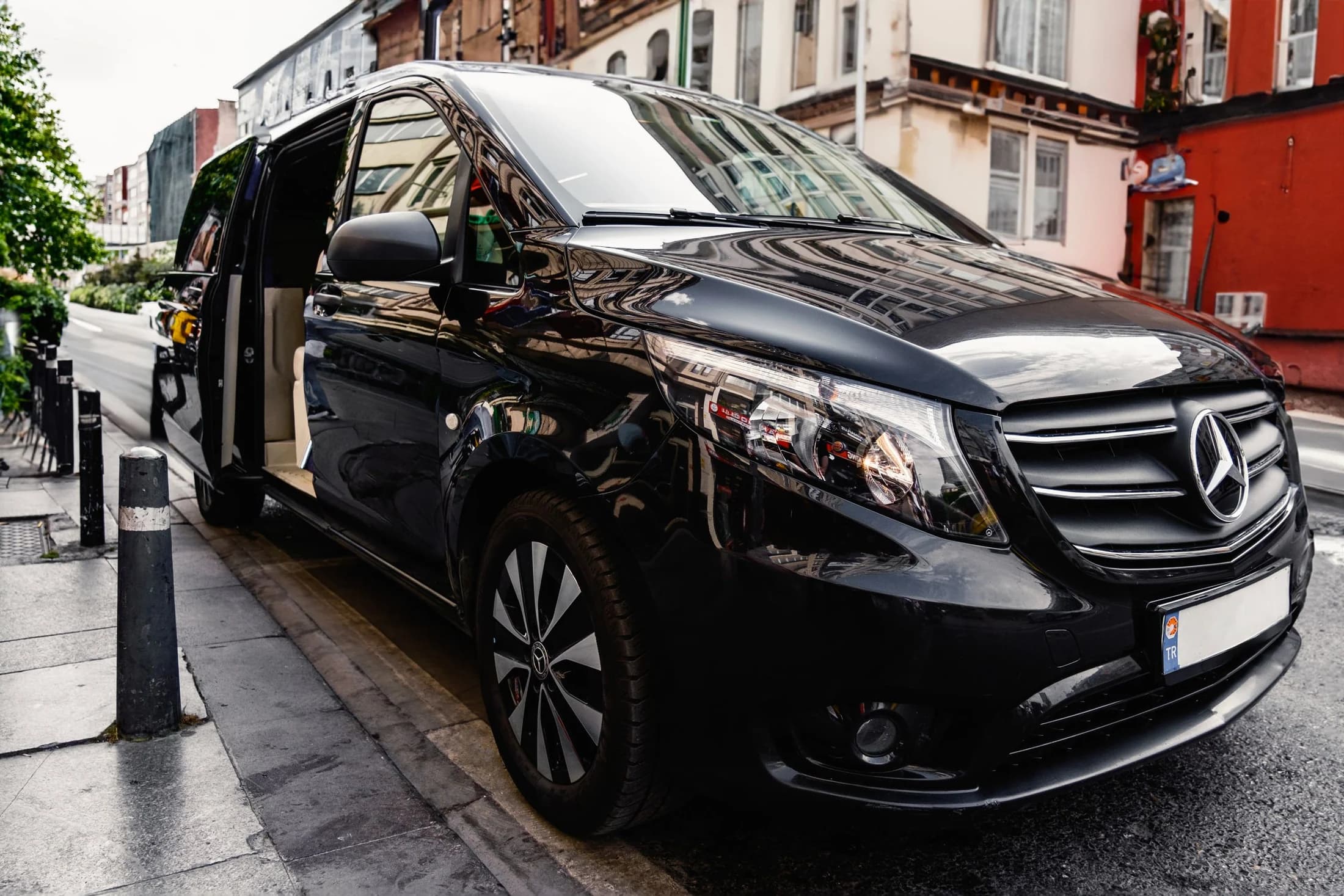 Black executive passenger van with its side door open