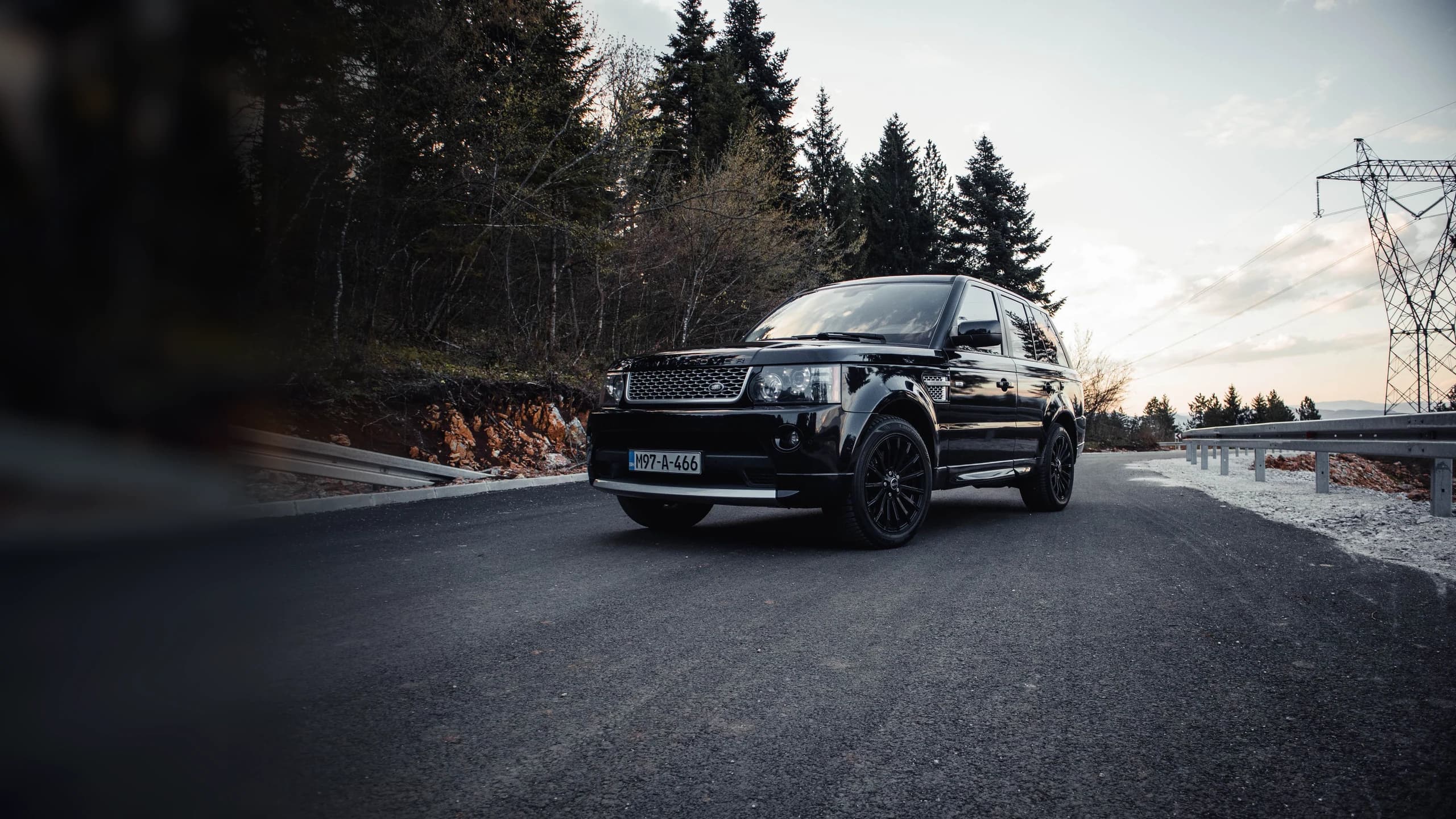 Black luxury SUV on an open road
